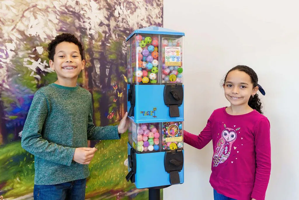 two kids at prize machine