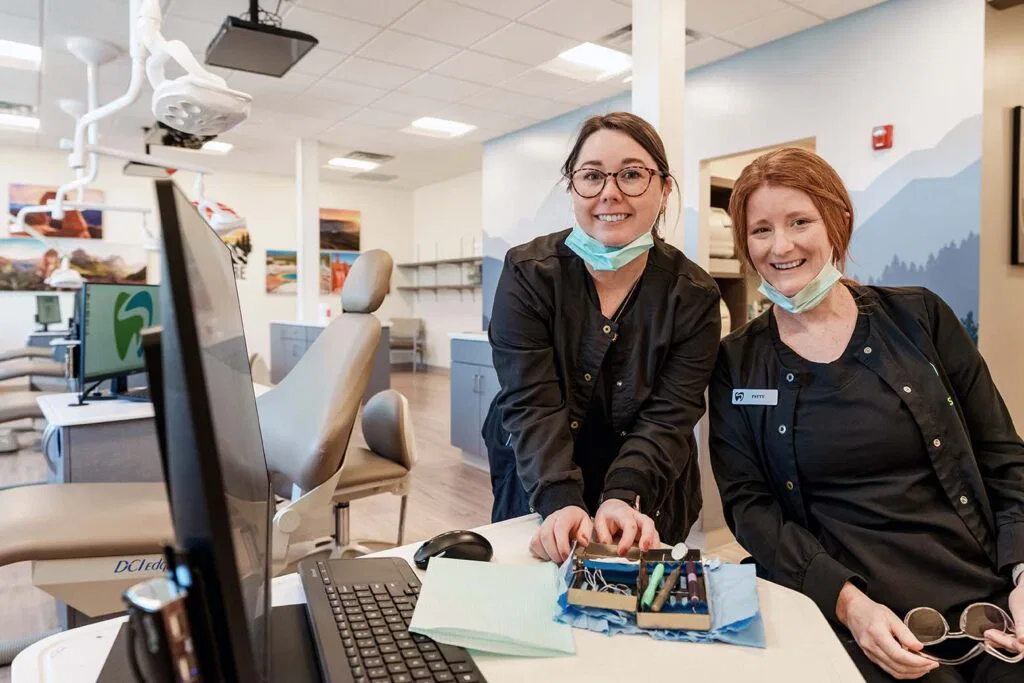 Dental assistants with instruments