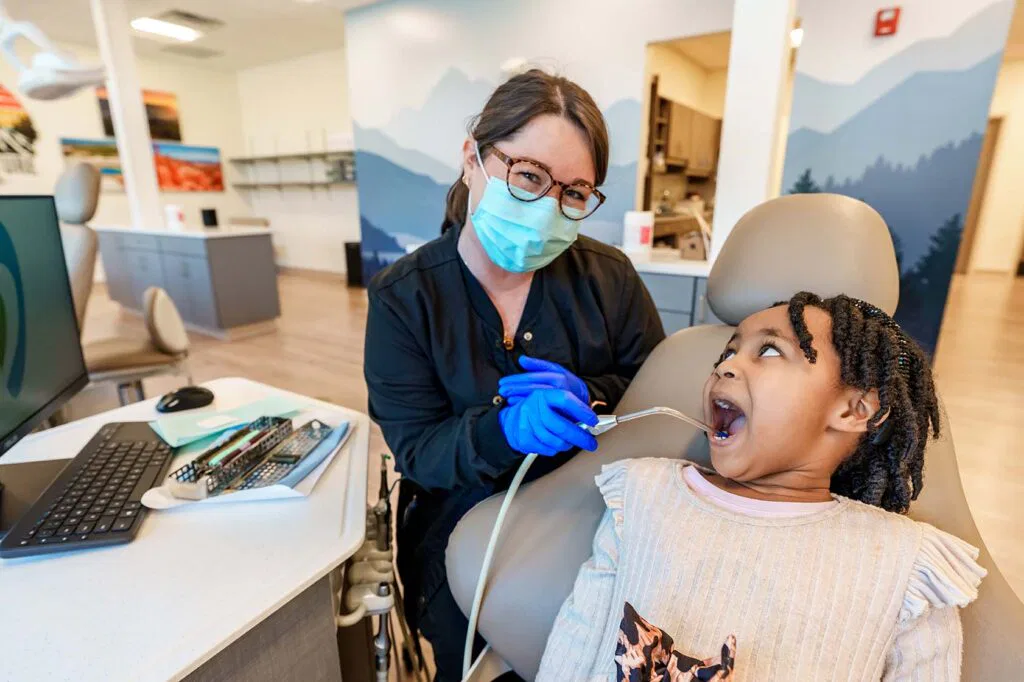Young girl getting teeth worked on