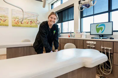 Dental assistant setting up chair