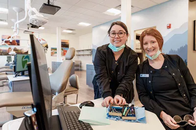 Dental assistants with instruments