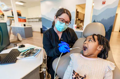 Young girl getting teeth worked on